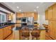 Spacious kitchen featuring stainless steel appliances, wood cabinets and a center island with a cooktop at 215 Sunland St, Louisville, CO 80027