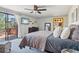 Relaxing bedroom features a sliding glass door and view to the deck at 31911 Warrens Rd, Golden, CO 80403