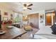 Eclectic bedroom showcases a large window, desk, sitting area, and unique artwork, creating an inspiring atmosphere at 31911 Warrens Rd, Golden, CO 80403