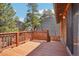 Relaxing deck area with scenic views and sturdy wooden railing, perfect for outdoor enjoyment at 31911 Warrens Rd, Golden, CO 80403