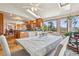 Open-concept area features a dining area with views to the bright kitchen at 31911 Warrens Rd, Golden, CO 80403