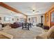 Expansive living space featuring a TV, wood-burning stove, exercise bike, seating and lots of space at 31911 Warrens Rd, Golden, CO 80403