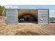 Spacious metal outbuilding interior with lighting, offering versatile storage and workspace solutions at 31911 Warrens Rd, Golden, CO 80403