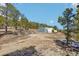 Durable metal outbuilding on a large lot surrounded by trees with ample space for storage or workshop at 31911 Warrens Rd, Golden, CO 80403