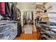 Organized walk-in closet with shelving and hanging racks for efficient storage and showcasing a neat arrangement at 31911 Warrens Rd, Golden, CO 80403