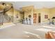 Basement featuring a wet bar, staircase, and ample living space at 1222 Buffalo Ridge Rd, Castle Pines, CO 80108