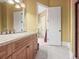 Bathroom with granite countertop, tile flooring, and a recessed light at 1222 Buffalo Ridge Rd, Castle Pines, CO 80108