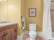 Well-lit bathroom featuring a vanity with granite countertops and a shower with beige tile at 1222 Buffalo Ridge Rd, Castle Pines, CO 80108