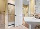 Bathroom features a pedestal sink and a tiled walk-in shower at 1222 Buffalo Ridge Rd, Castle Pines, CO 80108