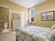 Neutral-toned bedroom with a large window and ensuite bathroom at 1222 Buffalo Ridge Rd, Castle Pines, CO 80108