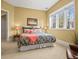 Comfortable bedroom with ample light, stylish decor, and plush bedding at 1222 Buffalo Ridge Rd, Castle Pines, CO 80108