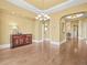 Formal dining room with hardwood floors and an ornate chandelier at 1222 Buffalo Ridge Rd, Castle Pines, CO 80108
