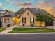 Charming single Gathering home features a stone and stucco exterior with a well-manicured lawn at 1222 Buffalo Ridge Rd, Castle Pines, CO 80108