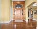 Grand foyer with a hardwood floor, decorative front door and elegant design at 1222 Buffalo Ridge Rd, Castle Pines, CO 80108