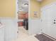 View into the laundry room, highlighting the cabinetry and layout at 1222 Buffalo Ridge Rd, Castle Pines, CO 80108
