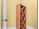 Wooden wine rack next to a white-trimmed door at 1222 Buffalo Ridge Rd, Castle Pines, CO 80108