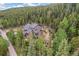 Secluded mountain home surrounded by lush green forest, offering privacy and a nature escape at 1758 Sinton Rd, Evergreen, CO 80439