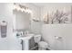 Cozy bathroom featuring a pedestal sink and decorative tree prints at 1758 Sinton Rd, Evergreen, CO 80439