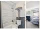 Modern bathroom showcasing bathtub with stylish tile, contemporary toilet, and access to a bedroom at 1758 Sinton Rd, Evergreen, CO 80439