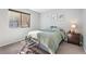 Well-lit bedroom with neutral colors, a comfortable bed, and warm sunlight at 1758 Sinton Rd, Evergreen, CO 80439