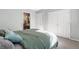 Comfortable bedroom showcasing closet, en suite bathroom, and neutral decor at 1758 Sinton Rd, Evergreen, CO 80439