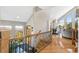 Bright entryway with hardwood floors, staircase and beautiful mountain views at 1758 Sinton Rd, Evergreen, CO 80439