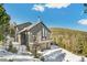 Beautiful exterior elevation with front facing balcony and drive under garage at 1758 Sinton Rd, Evergreen, CO 80439