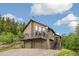 Inviting two-story home featuring a spacious balcony, two-car garage and well-maintained landscaping at 1758 Sinton Rd, Evergreen, CO 80439