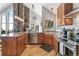 Spacious kitchen with wooden cabinets, granite countertops, and stainless steel appliances offers open concept living at 1758 Sinton Rd, Evergreen, CO 80439
