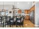 Kitchen featuring granite countertops, wooden cabinets, and stainless steel appliances with barstool seating at 1758 Sinton Rd, Evergreen, CO 80439