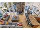 Bright living space with a wood-burning stove, open concept dining, and abundant natural light from large windows at 1758 Sinton Rd, Evergreen, CO 80439