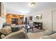 Cozy living room features wood paneling, stone fireplace, television, and comfortable seating at 1758 Sinton Rd, Evergreen, CO 80439