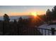 Beautiful view of the sunrise over a forest and low-lying clouds from the deck at 1758 Sinton Rd, Evergreen, CO 80439