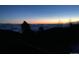 Scenic view featuring a clear sky over clouds and the silhouettes of mountains, showcasing the natural landscape at 1758 Sinton Rd, Evergreen, CO 80439
