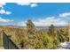 Mountain view from deck showcases natural landscape and clear blue skies at 1758 Sinton Rd, Evergreen, CO 80439