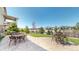 Spacious brick patio with various seating arrangements and meticulously maintained landscaping for elegant outdoor living at 8605 S Zante Ct, Aurora, CO 80016
