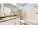 Modern bathroom with a granite countertop, updated fixtures, and a tiled shower at 8605 S Zante Ct, Aurora, CO 80016