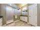 Well-lit bathroom with a glass block window, tiled shower, and modern fixtures at 8605 S Zante Ct, Aurora, CO 80016