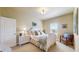 Comfortable bedroom with a white bed frame, ample natural light, and calming decor at 8605 S Zante Ct, Aurora, CO 80016