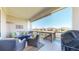 Relaxing outdoor deck with wicker furniture, covered roof, and neighborhood views at 8605 S Zante Ct, Aurora, CO 80016