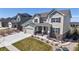 Charming two-story home with landscaped front yard, rock features, and long driveway at 8605 S Zante Ct, Aurora, CO 80016