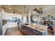 Gourmet kitchen with granite counters, stainless steel appliances, and a large island at 8605 S Zante Ct, Aurora, CO 80016