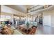 Open floor plan with spacious living room, fireplace, hardwood floors, and many windows at 8605 S Zante Ct, Aurora, CO 80016