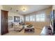 Cozy living room with comfortable seating, a large window, and a TV for entertainment at 8605 S Zante Ct, Aurora, CO 80016