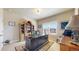 Bright office featuring a large desk, built-in shelving, and a sunlit window at 8605 S Zante Ct, Aurora, CO 80016