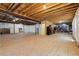 Large unfinished basement with exposed ceiling, providing ample space for future finishing at 12189 Windy Trail Ln, Parker, CO 80138