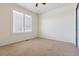 Empty bedroom with neutral carpet, shuttered windows and fresh paint at 12189 Windy Trail Ln, Parker, CO 80138