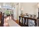 Stylish entryway with hardwood floors, console table with decorative accents, and a view into the living room at 12189 Windy Trail Ln, Parker, CO 80138
