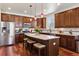 Modern kitchen featuring granite countertops, stainless steel appliances, and a breakfast bar with seating at 12189 Windy Trail Ln, Parker, CO 80138