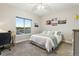 Inviting bedroom featuring a picture window with scenic view, contemporary decor, and soft natural light at 20201 Royal Troon Dr, Monument, CO 80132